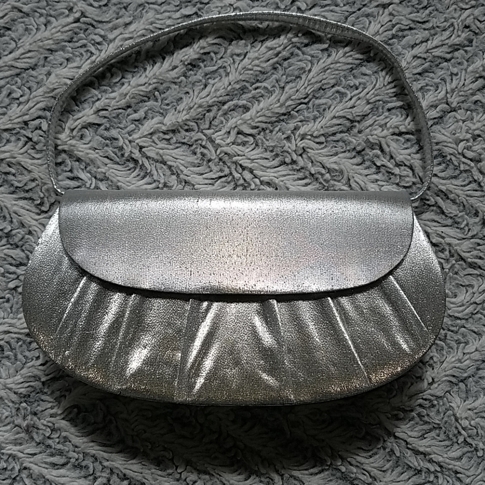 Silver convertible handbag with pleats by La Regale